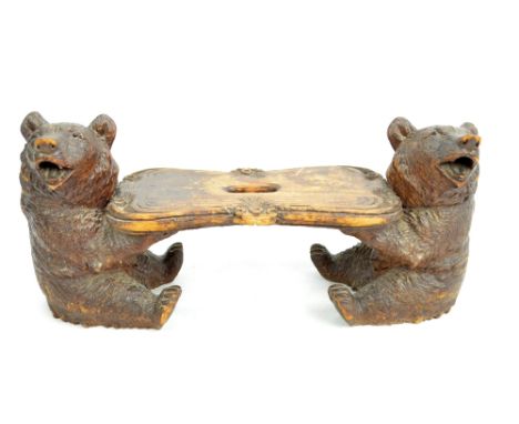 A Black Forest carved bear stand/stool, 20.5 x 48cm.
