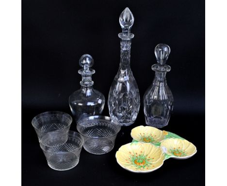 A collection of cut glass to include three decanters, three tea caddy bowls, tumblers, wine and sherry glasses, also a Carlto