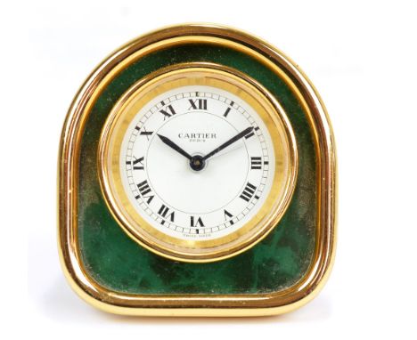 CARTIER; a gilt metal framed and malachite effect fronted travel clock with easel back and sapphire coloured cabochons to adj