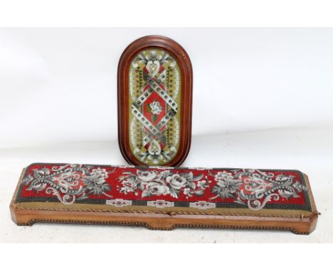 A Victorian floral bead work decorated foot stool with inlaid bands, length 11cm, and a similar oval tray on castors with gla