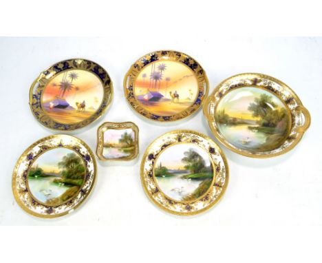 A Noritake twin handled bowl decorated with swans, a pair of matching circular plates and a small pin dish, also a pair of Ca