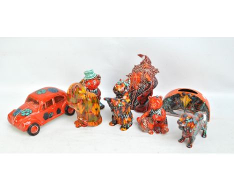 Eight Anita Harris ceramic figures including a car, dogs, cat, etc. CONDITION REPORT: Please refer to additional photographs,