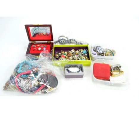 A collection of various costume jewellery including ear clips, various predominantly bead necklaces, rings, brooches and a cl