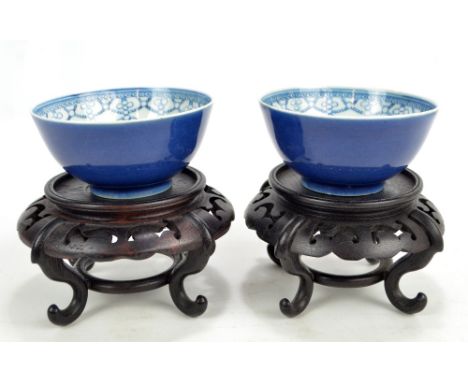 A pair of late 19th century Chinese porcelain circular bowls painted in underglaze blue with longevity circular seal mark to 