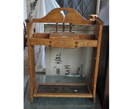 An Arts and Crafts oak stick stand, height 85cm.