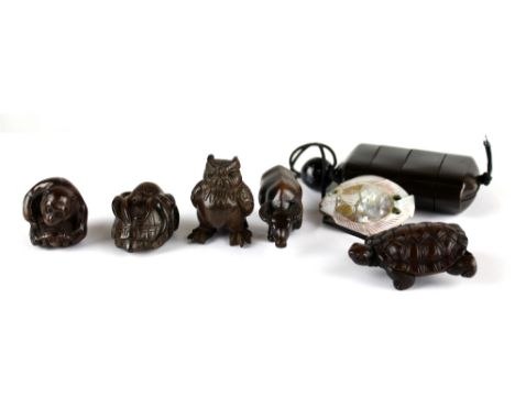 Five wooden netsuke modelled as a monkey and tortoise, owl, buffalo, octopus and tortoise, and another, a mother of pearl exa