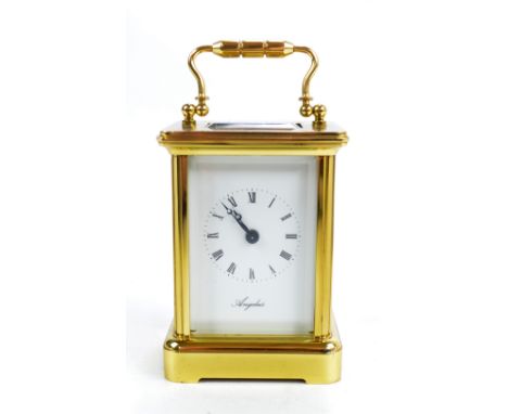 ANGELUS; a small brass carriage clock, the dial set with Arabic numerals, height 7.5cm.