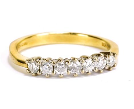 An 18ct yellow gold and diamond seven stone ring, stamped 'DIA 0.5' to inner band, size P 1/2, approx 3.7g.