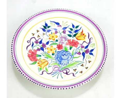 A Poole Pottery footed bowl with painted floral decoration, printed mark to base, diameter 33.4cm.