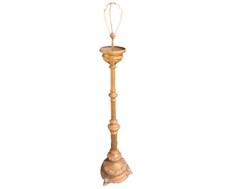 A Heavy Brass Standard Lamp raised above 3 winged feet. 3 graduated tiers rising on fluted columsHeight to top of light fitti