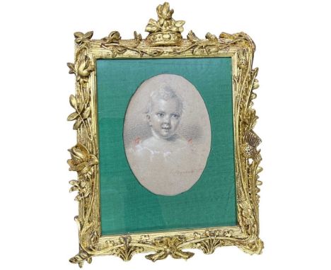 A French early 19th Century pastel and pencil portrait of a young child, signed E Beyerhaut (?) in a 19th century elaborately