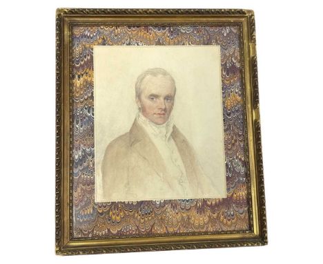 An Early 19th Century Pencil and Wash Portrait of a Gentleman in an antique gilded frame with a hand marbled mount.