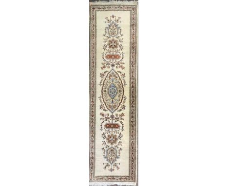 A vintage late 20th century Persian Islamic Tabriz Taba Tabai floor carpet rug runner having a cream background with central 