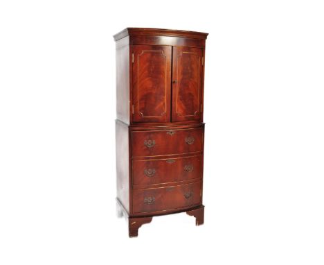 20th century George III revival bow front mahogany cocktail drinks cabinet. Raised on bracket feet with bank of drawers to th