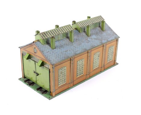 A Hornby O gauge tinplate Engine Shed. Lithographed in orange brickwork with a grey roof and green base