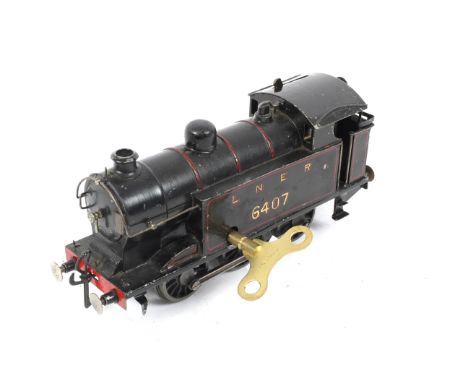 0 gauge LNER 0-6-0 6407 tank engine. Scratch built, with clockwork mechanism and key. Condition Report:  slight wear shown by