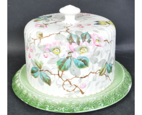 A Victorian 19th century ceramic cheese dish &amp; base of circular form. The lid having hand painted floral &amp; butterfly 