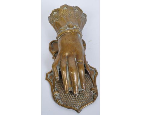 A 19th century Victorian J &amp; R Ratcliff brass hand letter clip holder. The hand having decorative cuffed sleeve and signe