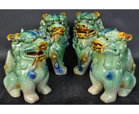 Two pairs of vintage 20th century circa 1970s ceramic Oriental&nbsp; temple dogs of fu / Fu-Dogs in a green colourway. The it