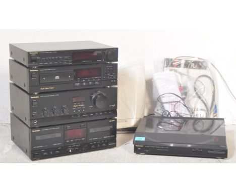 A vintage 20th Century Technics audio hi fi stacked system. With a automatic turntable system SL - J110R, stereo tuner ST - X