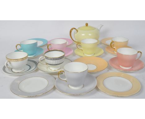 A vintage 20th century Wedgwood bone china tea service comprising of six teacups saucers and side plates (trios) and teapot. 