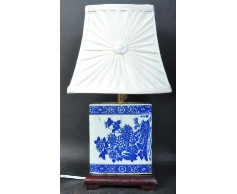 A vintage 20th century blue &amp; white Chinese&nbsp; pillow vase lamp with floral decoration converted in a table lamp raise