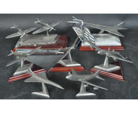 An assortment of vintage late 20th century English Pewter airplane miniatures to include Concorde, Spitfire, The Lancaster, 7