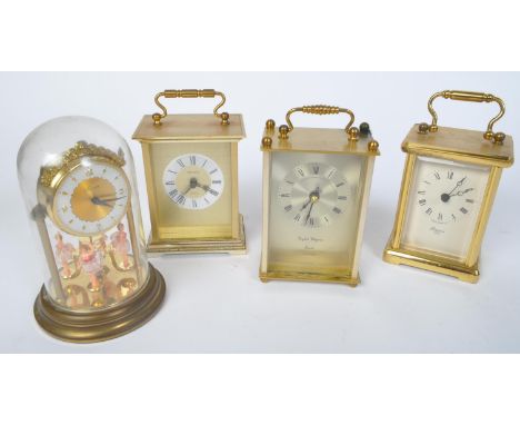 An assortment of 20th century brass metal battery carriage clocks to include a President Quartz clock, an English Elegance Qu
