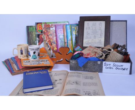 A collection of 20th century &amp; later Scouts memorabilia to include uniform shirts, guide badges, 29th edition of Scouting