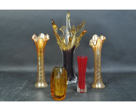 A collection of retro vintage mid 20th Century carnival glass. Having a flame style curved rimmed form, with patterned purple