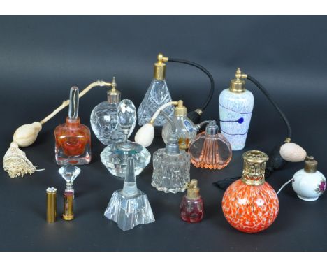 A collection of 19th century Victorian and vintage glass scent bottles and perfume atomizers. a rub glass flash cut bottle, a