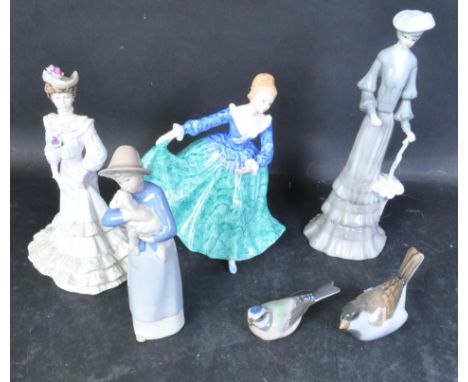 An assortment of 20th century vintage porcelain bone china figurines to include Royal Doulton Janette HN3415, a Coalport Loui