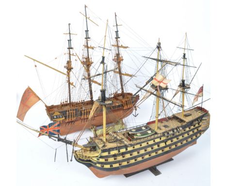 A pair of 20th century vintage 20th century scratch built hand painted model boats. Measures 40cm length.&nbsp;