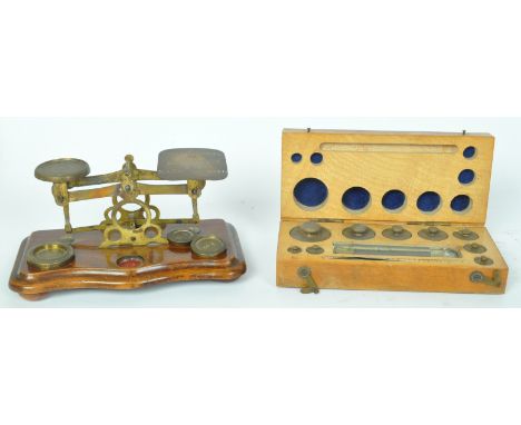 A Victorian 19th century postal brass &amp; wood scale for letter rates comprising of three weights, together with an assortm
