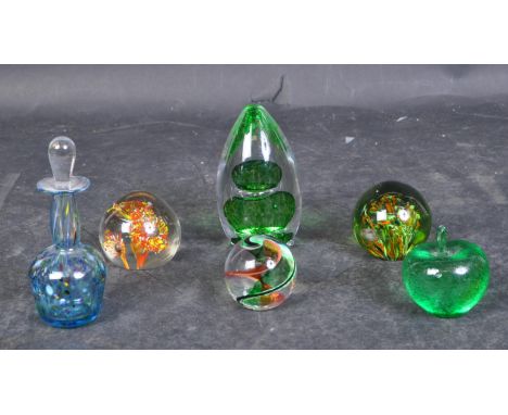 A collection of vintage 20th Century glass paperweights. To include, apple, small scented bottle, millefiori style, swirls an