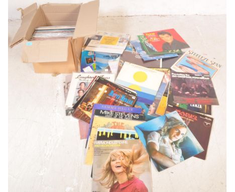 A collection of vintage 20th Century 7" 45 rpm vinyl single records, Elvis Presley, Billy Ocean, Refugee, Haircut One Hundred