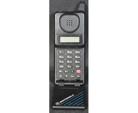 A vintage retro 20th century Motorola phone Micro T.A.C Classic. Held within a case. Measures 14cm length.&nbsp;