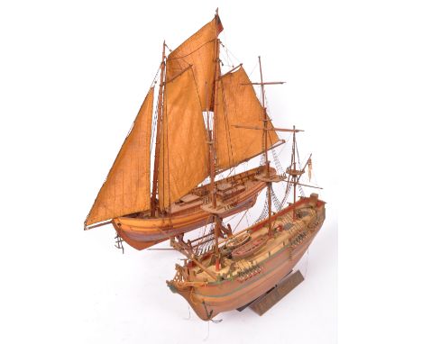 Two vintage 20th century scratch built and hand painted model boats. Measures 41cm length.