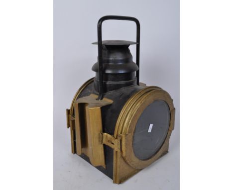 A 20th century starboard ships lantern - navigation light brass fixtures upon ebonised metal construction. Measures 40cm tall
