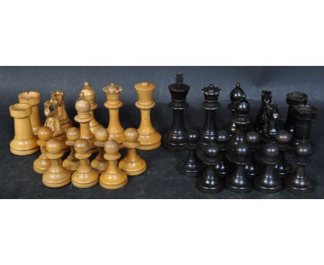 A set of vintage 20th century turned wood chess pieces, the majority having baize undersides. Largest measures approx 70mm.