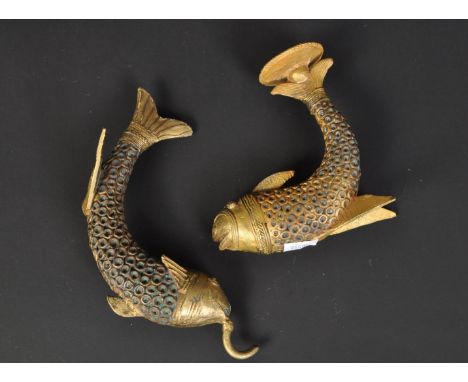 A pair of vintage gilt metal fish. Of curved form with circular repeating pattern to body and gilt fins. One a candle stick h