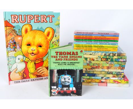 A collection of vintage Rupert The Bear Daily Express annuals and Ladybird Thomas The Tank Engine books. Rupert annuals datin