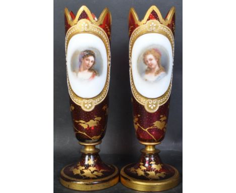 A pair of late 19th century Bohemian ruby glass portrait vases of tapering cylindrical form raised on round base. Each vase h