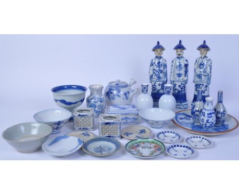 An assortment of 20th Oriental Chinese &amp; Japanese blue &amp; white ceramic items to include figures, plates, bowls, vases