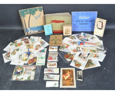 A vintage 20th century black and white and early colour photograph card album - views of interest together with loose stamps 
