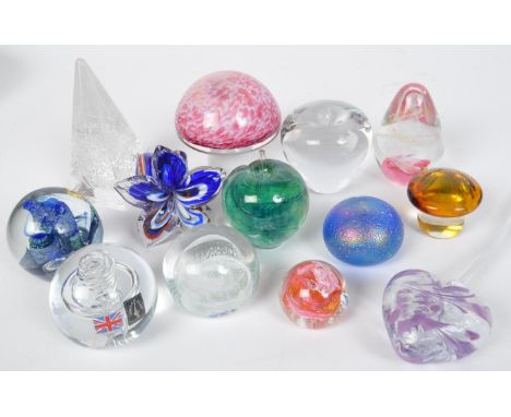 A collection of vintage studio art glass paperweights. Including mushroom, helix twist, Langham glass, pearlescent, toadstool