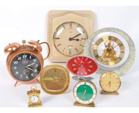 An assortment of vintage retro mid 20th century clocks to include a ceramic Junghans wall clock, Jenger chrome clock, Werle a