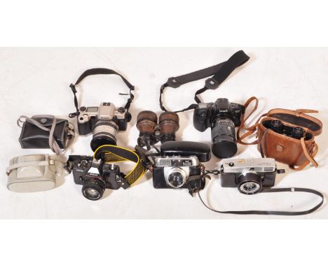 A collection of vintage 20th Century film cameras. Comprising of Canon Canonet, Minolta Dynax 5000si, Sigma SA-5, Fuji STX-2,