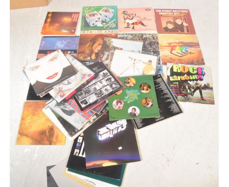 A collection of vintage 20th century LPs long play records comprising of Elvis Presley, Dire Straits, Badlands, Styx, Genesis