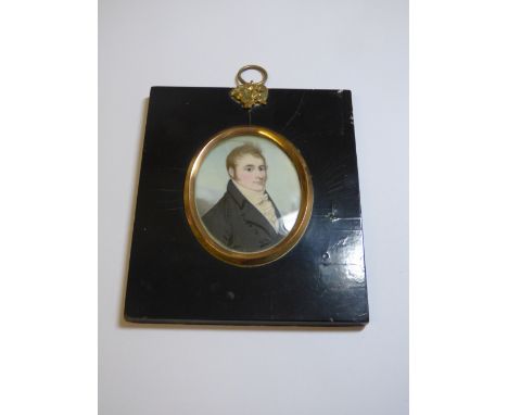 19TH CENTURY PORTRAIT MINIATURE OF YOUNG GENTLEMAN IN DARK SMOCK COAT,WHITE CRAVAT- THE VERSO LABEL PAINTED OCT 1807 THE SITT